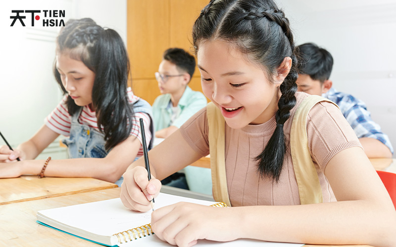 Students doing a worksheet on their desks
