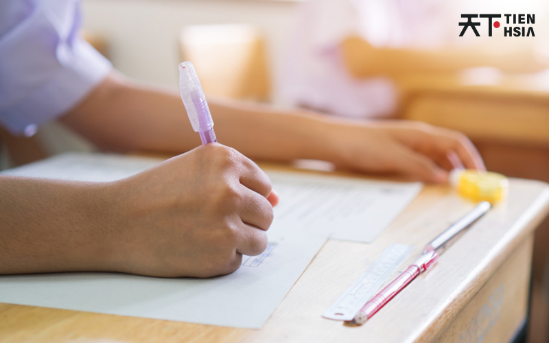 Student writing in class