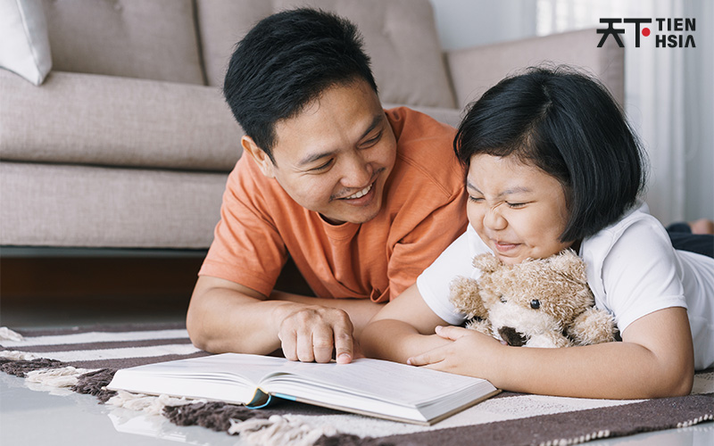 Father and daughter studying Chinese at home