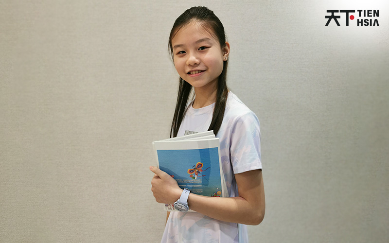 Smiling student succeeding in Chinese composition